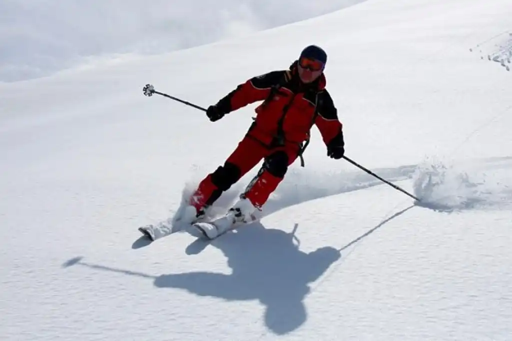 Ski mountaineer climbing a ridge in the Kichi Suusamyr range